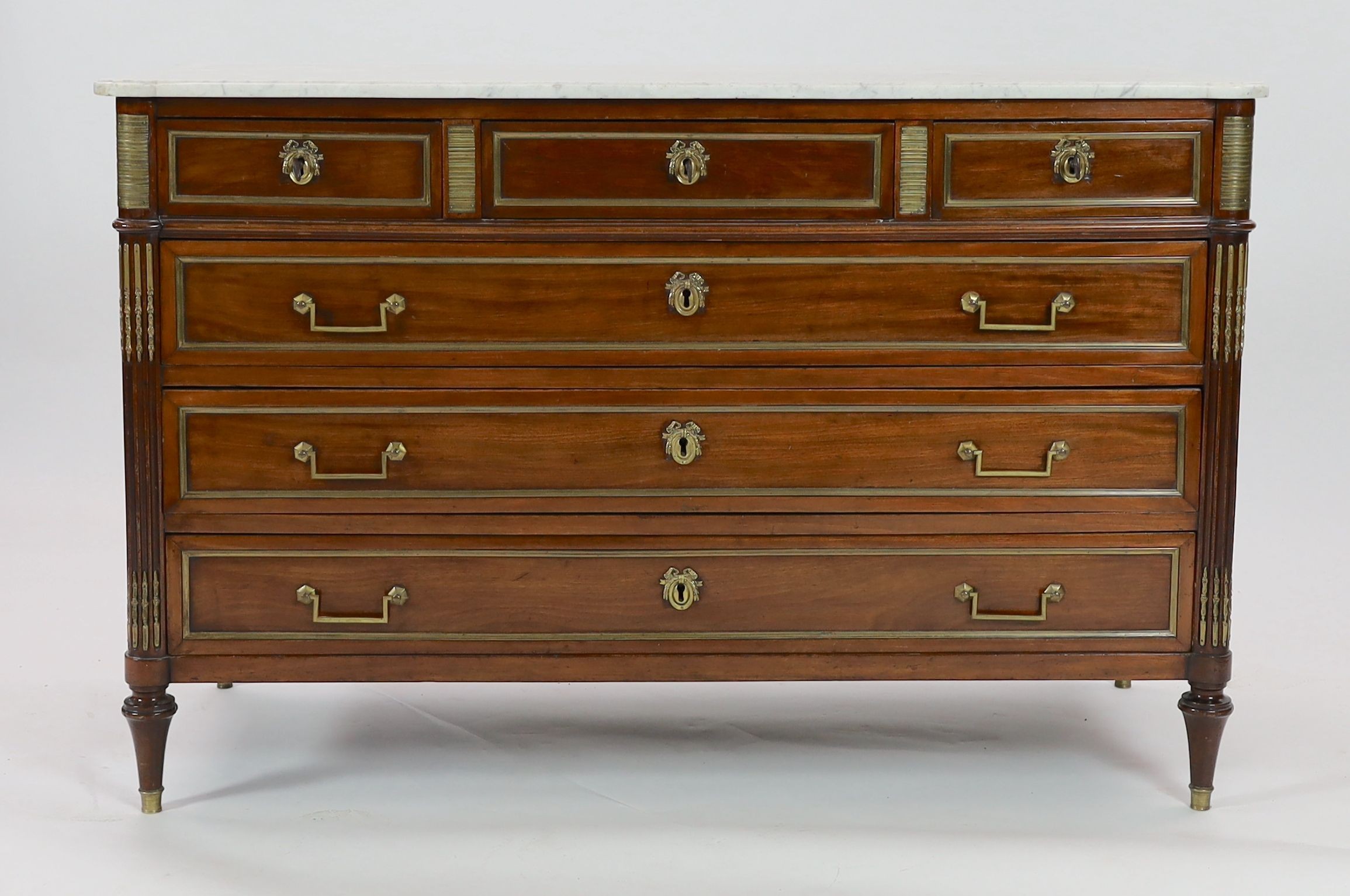 A 1790's French Directoire period brass mounted mahogany commode, W.146cm D.65cm H.95cm